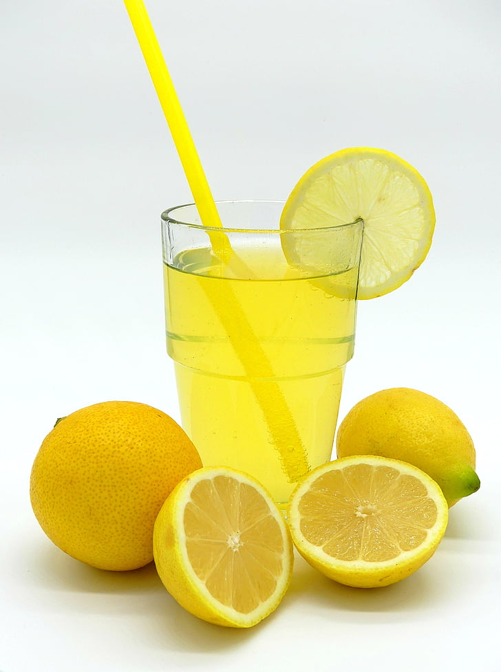 clear glass cup filled with lemon juice