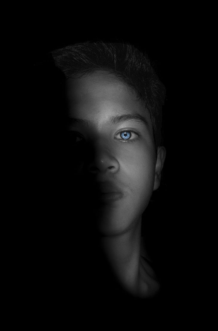 blue-eyed man in the dark