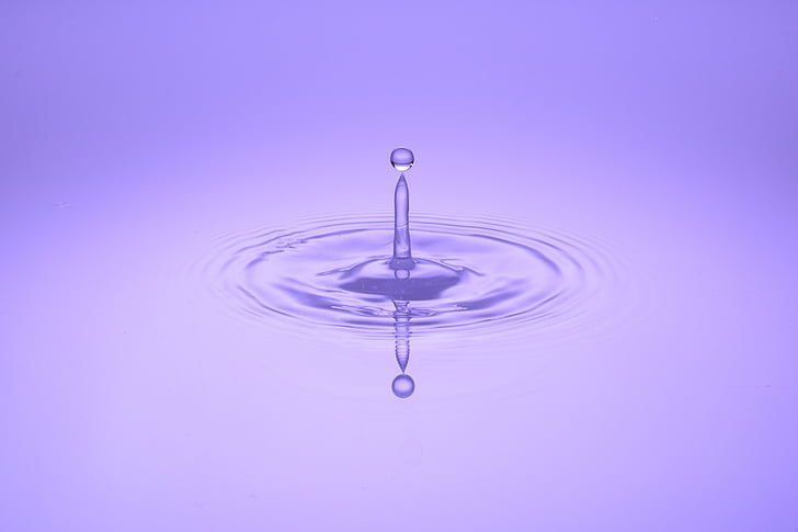 water drop with purple background