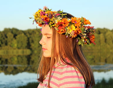 girl wearing assorted-color flower headband