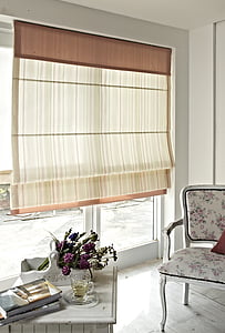 room with brown and white window curtain brown wooden chair