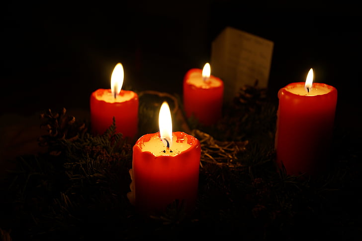 four red pillar candles