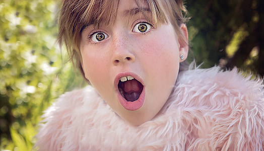 selective focus photo of girl open mouth wearing fur top