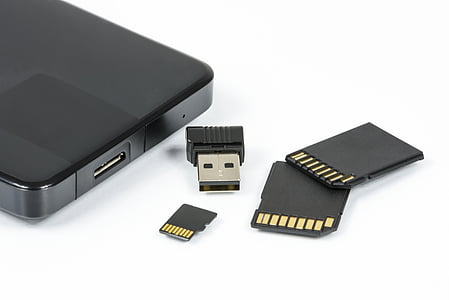 shallow focus photography of black micro-SD memory card with adapter