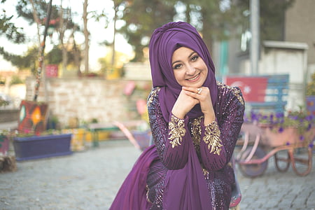 woman wearing purple hijab with purple abaya photo