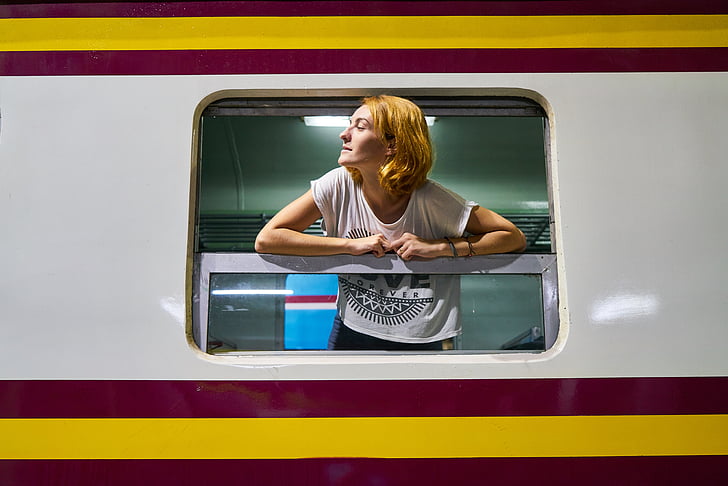 woman leaning on train window