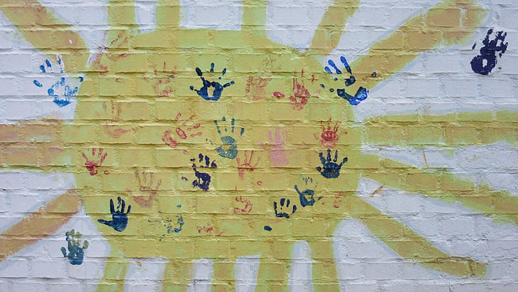 assorted-color of hand prints printed on wall