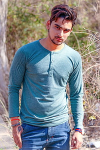man wearing blue Henley shirt