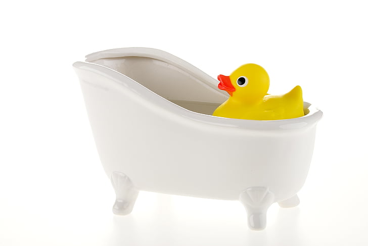 rubber ducky white bathtub on bathtub