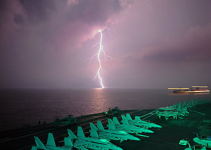 photo of lightning near aircraft carrier