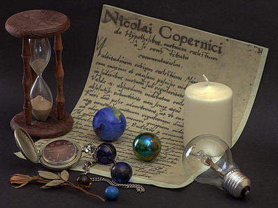 pocket watch, marbles, and white candle