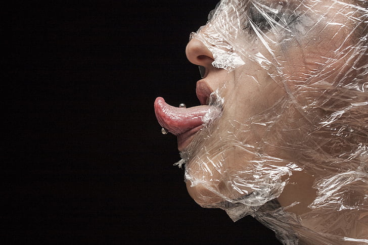 clear plastic pack covered on human face