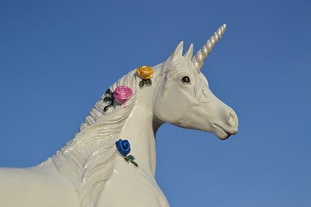 gray unicorn statue during daytime