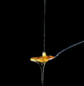 yellow syrup on spoon