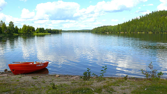 red boat near lake