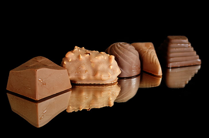 photo of five brown chocolates