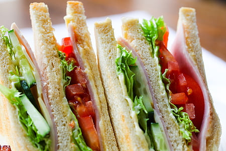 close up photo of tomato, lettuce and ham sandwich