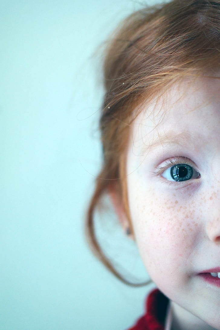 selective focus photography of girl's face