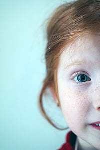selective focus photography of girl's face