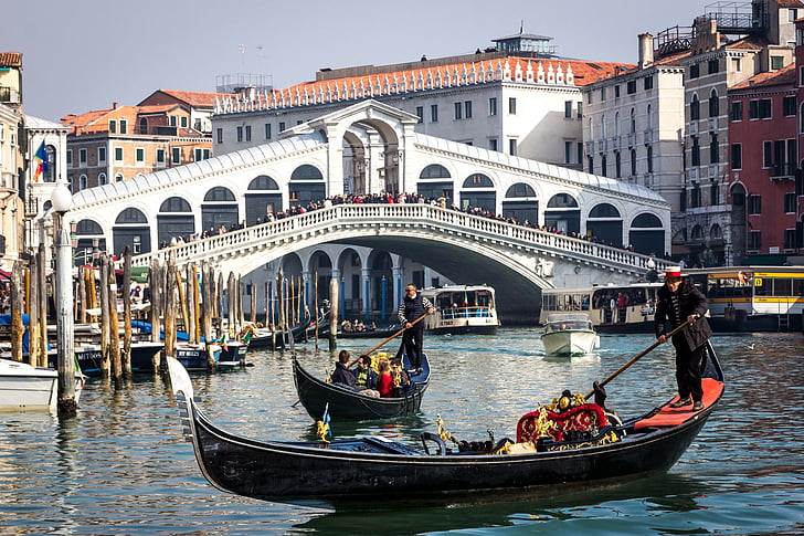 two black canoes on Rialto Bridge, Italy