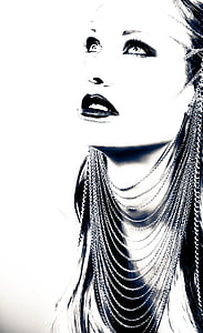 grayscale photography of woman wearing multi-layered necklace