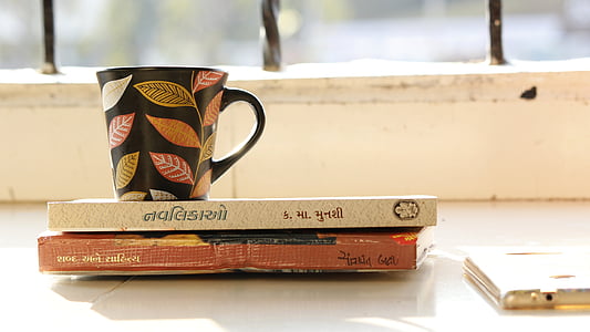 mug on books