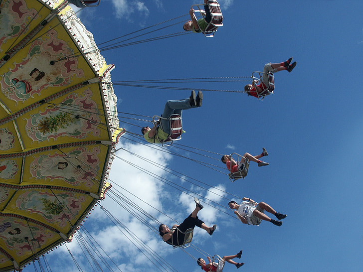group of people riding hanging swing carnival ride