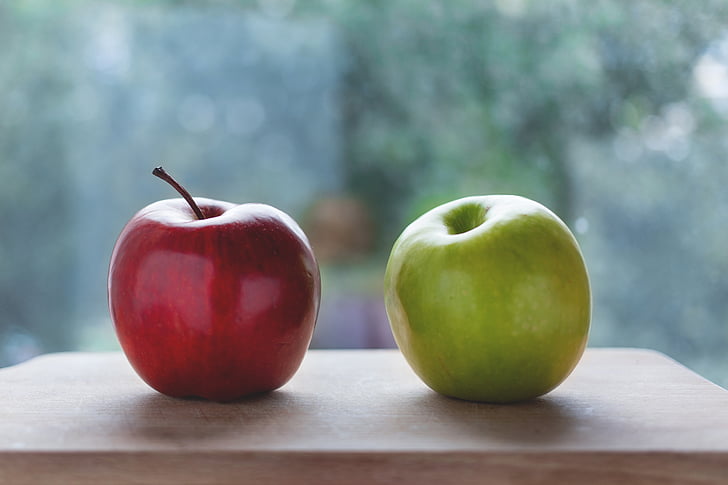 depth of field photography of red and green apples