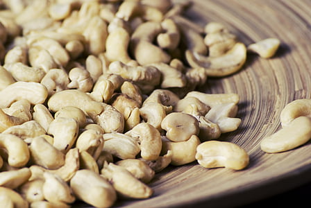 bunch of cashew nuts on brown plate