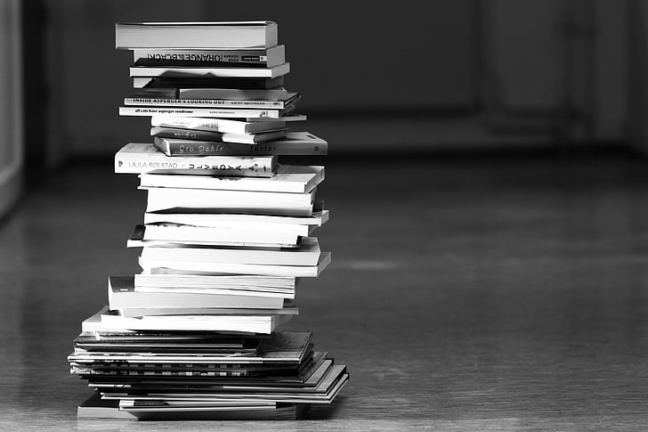 greyscale photography of book lot