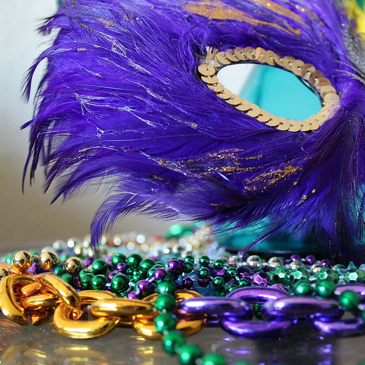 photo of purple and gold masquerade mask