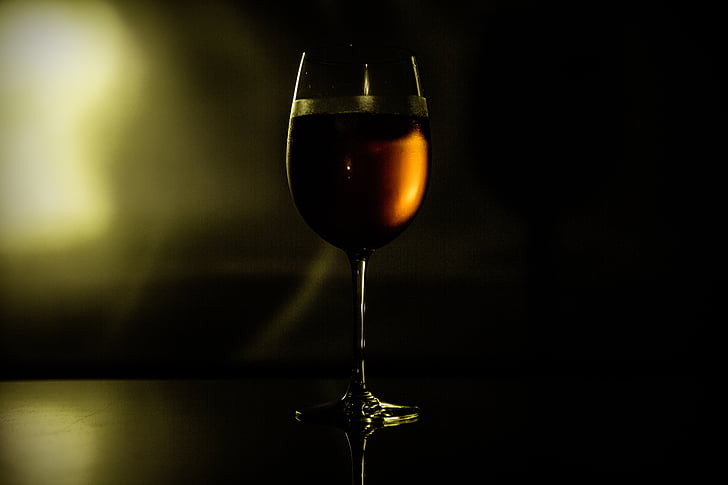 wine glass filled with red wine