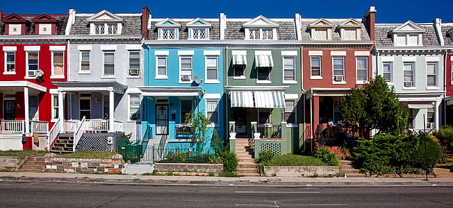 white, red, gray, and blue painted buildings