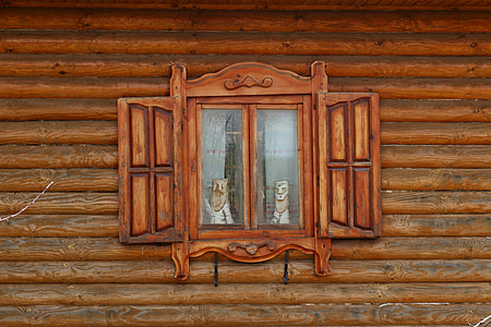 window with brown wooden frame painting