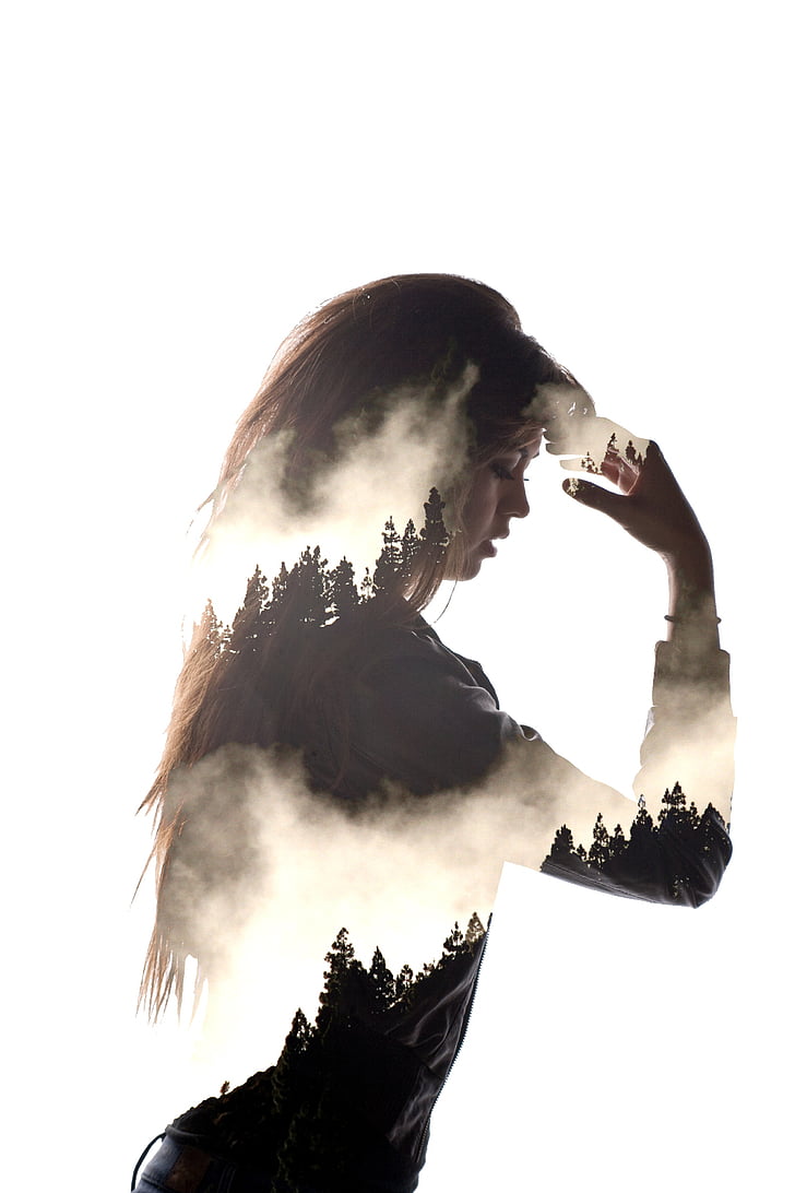 edited photo of woman and pine trees