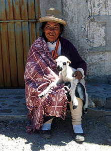 woman holding sheep