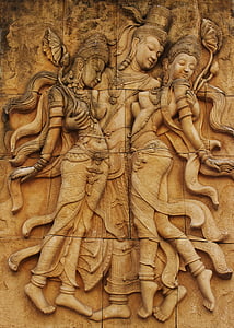 photo of three Hindu deity high relief