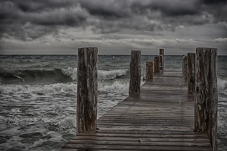 brown dock during cloudy day