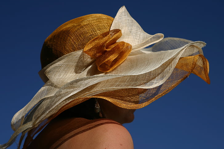 woman wearing white and brown sun hat