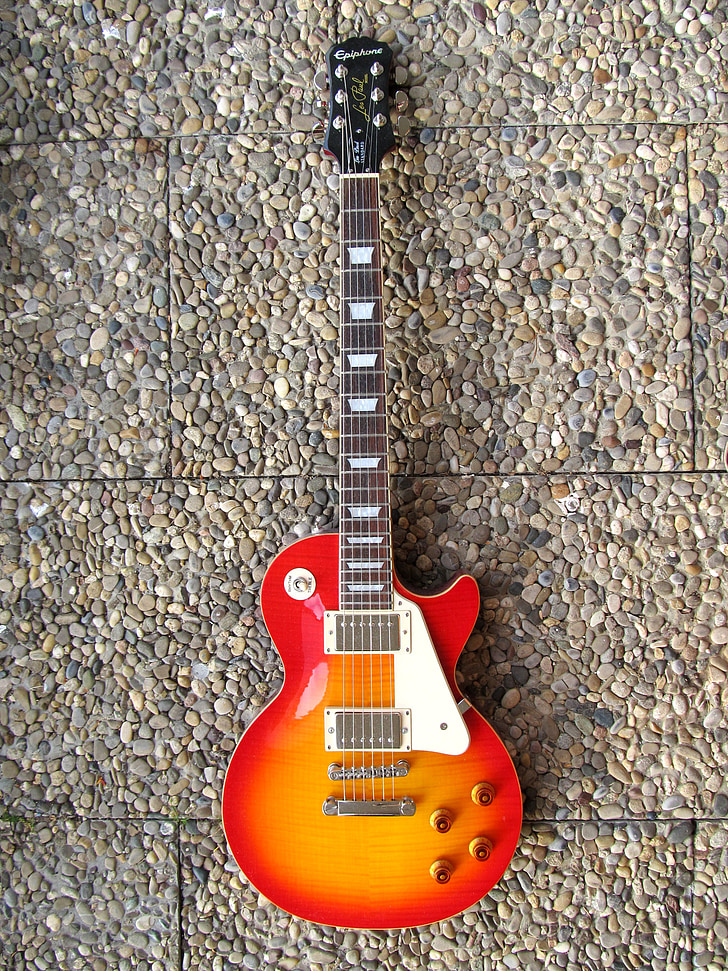 red and orange electric guitar