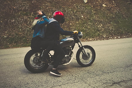 photo of two woman and man riding motorcycle