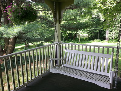 white wooden bench swing