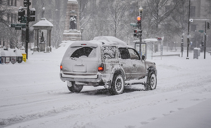 grey SUV with snow cap