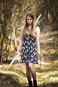 woman holding bow and arrow