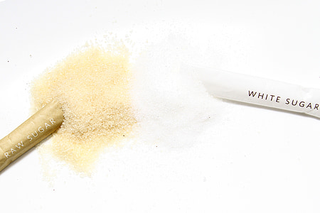 white sugar and raw sugar powders with packs