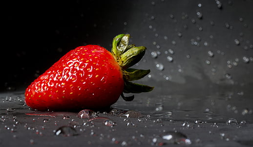 strawberry on wet surface