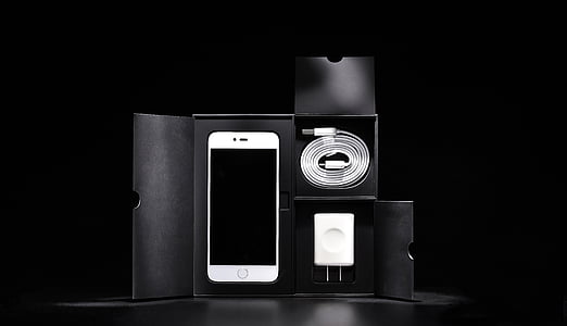 white Android smartphone with charger and box
