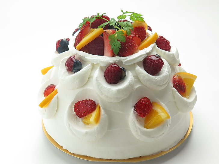 white icing cake with strawberry and citrus fruits