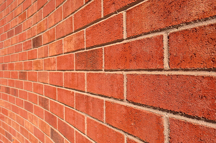 red brick wall during daytime photography