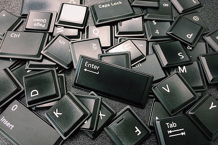 black computer keyboard keys on black surface
